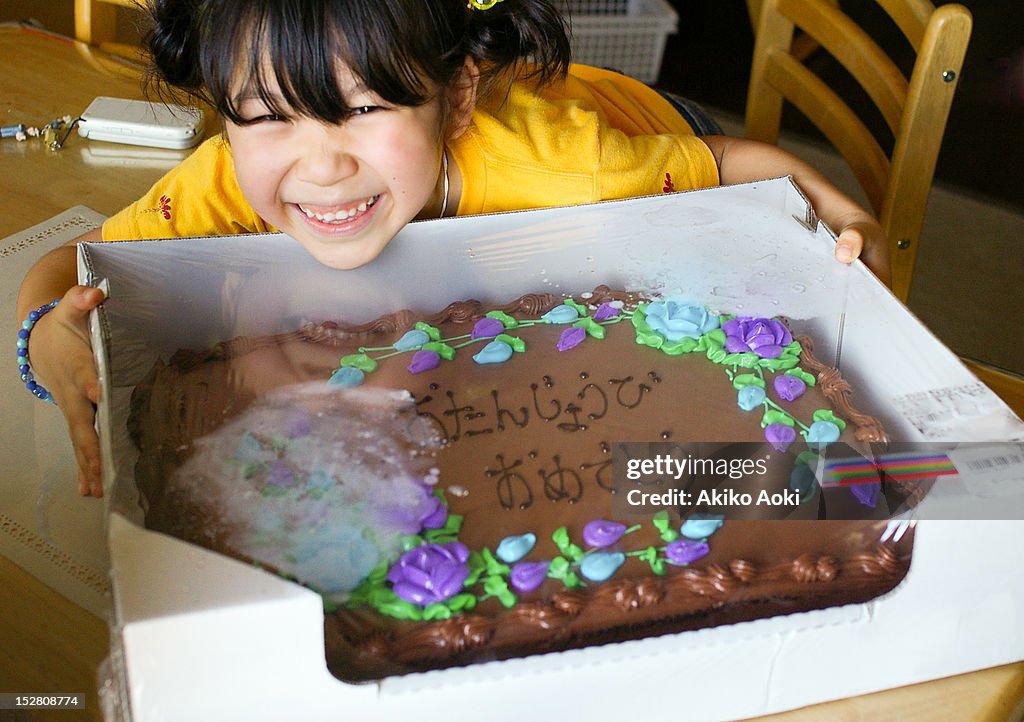 Girl and birthday cake