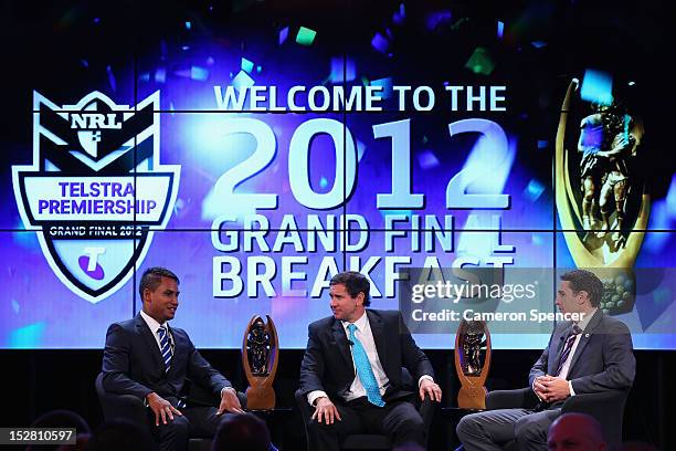 Ben Barba of the Bulldogs and Billy Slater of the Storm are interviewed by Matt Johns during the 2012 NRL Grand Final breakfast at Doltone House on...