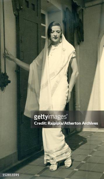 Scottish-born silent film actress and model Ella Atherton wearing a sari at Vijay Palace, Rajpipla, Gujarat, India, 1933. Atherton later married...