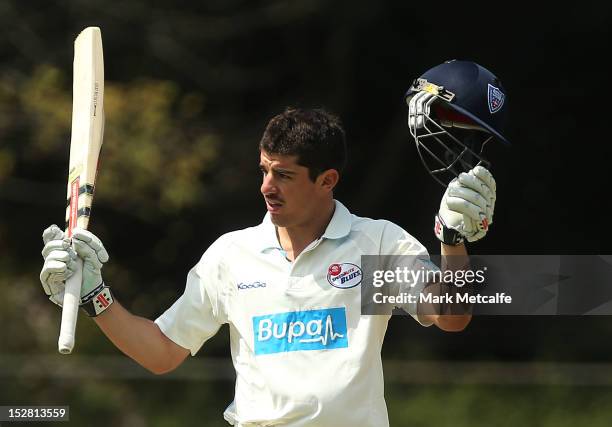 Moises Henriques of New South Wales celebrates scoring a 150 during day two of the Sheffield Shield match between the New South Wales Blues and the...