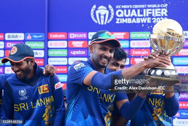 Dasun Shanaka of Sri Lanka lifts the ICC Men´s Cricket World Cup Qualifier Trophy as players of Sri Lanka celebrate qualification after defeating...