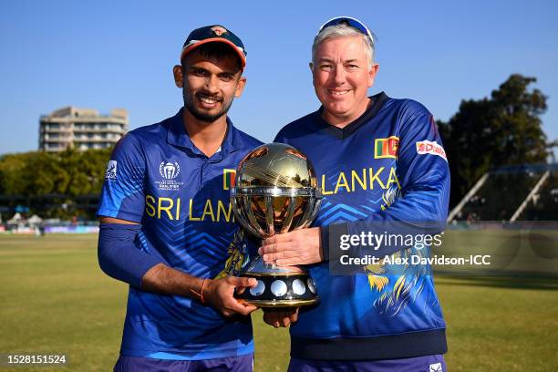 Dasun Shanaka of Sri Lanka and Chris Silverwood, Head Coach of Sri Lanka, pose for a photo with the ICC Men´s Cricket World Cup Qualifier Trophy...