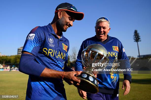 Dasun Shanaka of Sri Lanka and Chris Silverwood, Head Coach of Sri Lanka, pose for a photo with the ICC Men´s Cricket World Cup Qualifier Trophy...