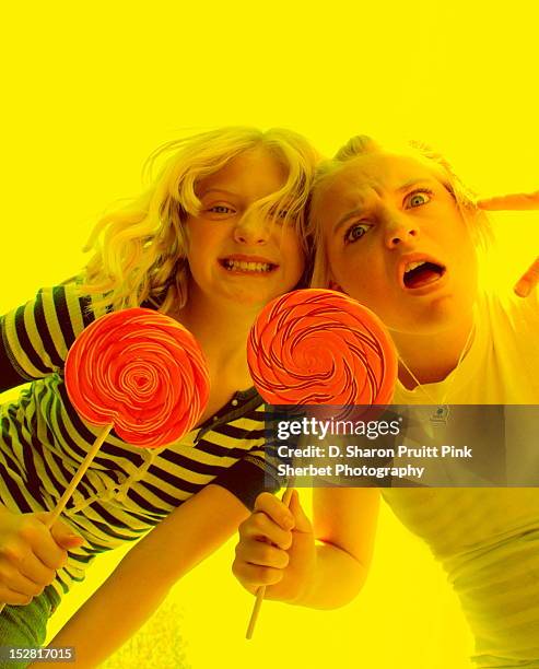 funny girls with big lollipops - girl lollipops stock pictures, royalty-free photos & images