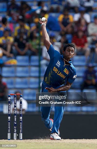 Ajantha Mendis of Sri Lanka bowls during the C1 versus D2 Super Eight match between Sri Lanka and New Zealand at Pallekele Cricket Stadium on...