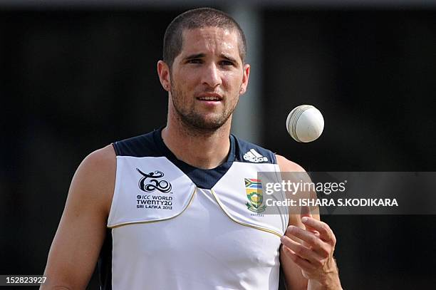 South Africa cricketer Wayne Parnell tosses a ball during an ICC Twenty20 Cricket World Cup practice session at the P. Sara Oval Cricket Stadium in...