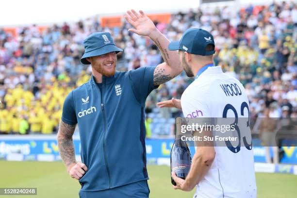 England captain Ben Stokes high fives with man of the match Mark Wood at the presentations after winning the LV= Insurance Ashes 3rd Test Match...