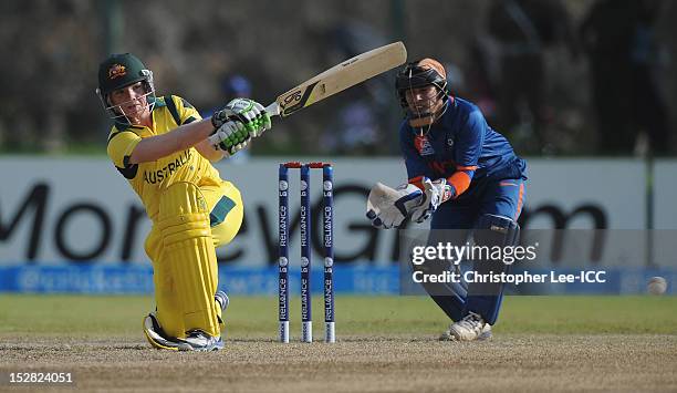 Jess Cameron of Australia in action as Sulakshana Naik of India watches during the ICC Women's World Twenty20 Group A match between Australia and...