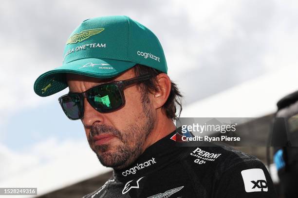 Fernando Alonso of Spain and Aston Martin F1 Team looks on from the grid prior to the F1 Grand Prix of Great Britain at Silverstone Circuit on July...
