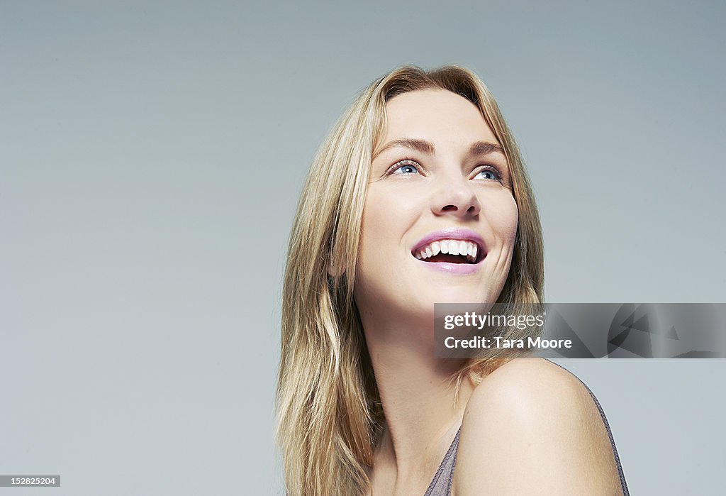 Beautiful woman looking up and smiling