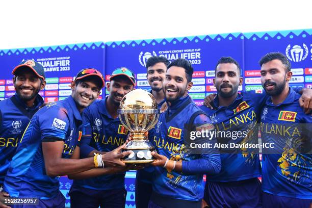 Dasun Shanaka of Sri Lanka lifts the ICC Men´s Cricket World Cup Qualifier Trophy as players of Sri Lanka celebrate qualification after defeating...