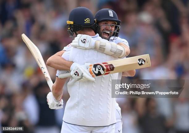 Mark Wood and Chris Woakes celebrate after England won the 3rd Test between England and Australia at Headingley on July 09, 2023 in Leeds, England.