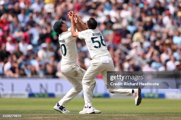 Pat Cummins of Australia collides with Mitchell Starc as he catches out Harry Brook of England during Day Four of the LV= Insurance Ashes 3rd Test...