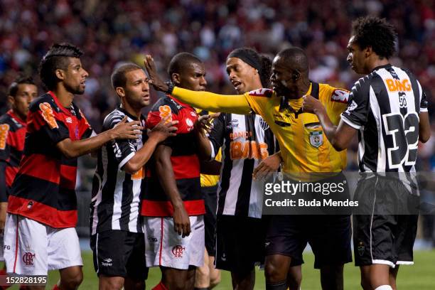 Players of Flamengo and of Atletico Mineiro discusses with the referee Jailson Macedo Freitas during a match between Flamengo and Atletico Mineiro as...
