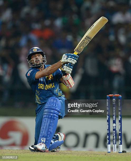 Tillakaratne Dilshan of Sri Lanka hits out for six runs during the ICC World Twenty20 2012 Super Eights Group 1 match between Sri Lanka and New...