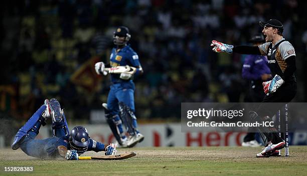 Tilakaratne Dilshan of Sri Lanka is run out by Brendon McCullum of New Zealand during the C1 versus D2 Super Eight match between Sri Lanka and New...