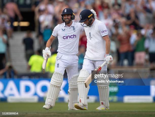 Chris Woakes of England celebrates with Mark Wood after hitting the winning runs to win the LV= Insurance Ashes 3rd Test Match between England and...