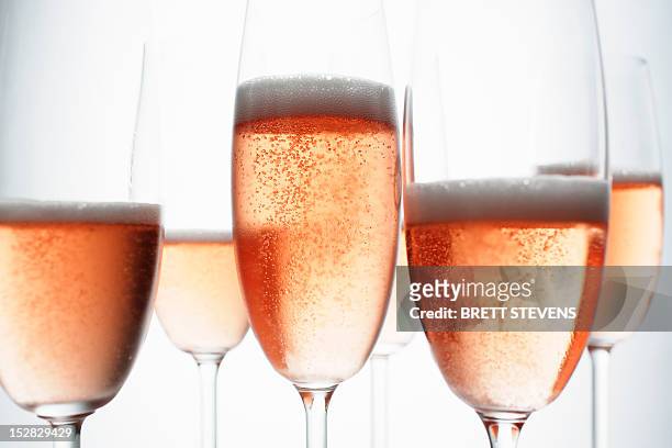 close up of glasses of champagne - prosecco stock-fotos und bilder