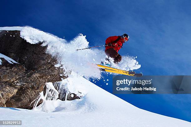 skier jumping on snowy slope - kanton wallis 個照片及圖片檔