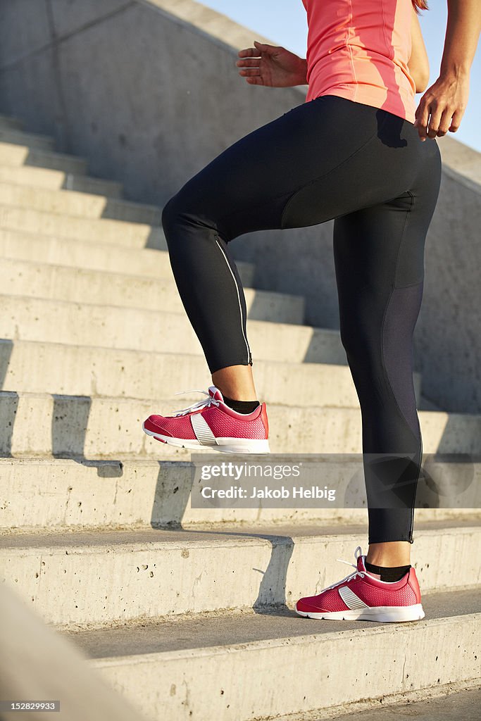 Woman running on staircase