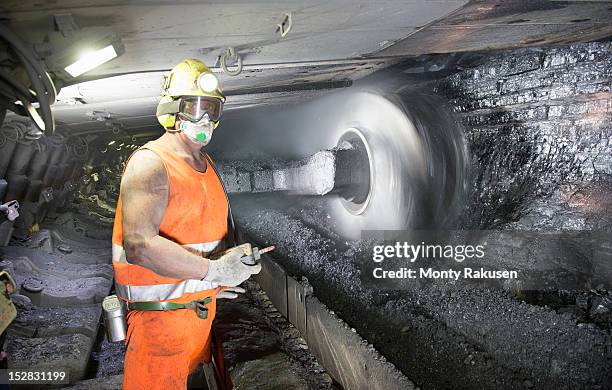 miner cutting coal at coalface in deep mine - mining machinery bildbanksfoton och bilder