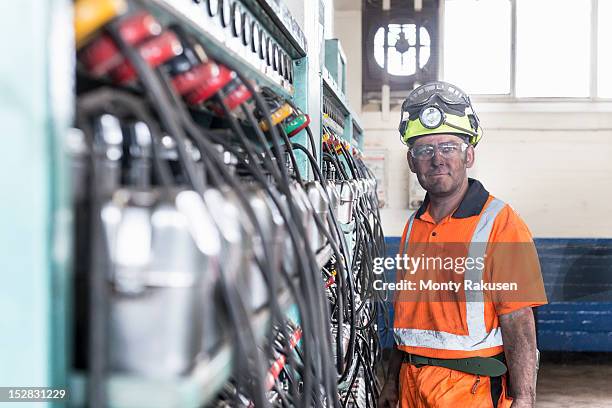 portrait of coalminer in lamp room of deep mine - miner helmet portrait stock pictures, royalty-free photos & images