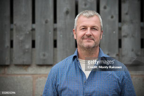 portrait of farmer smiling, head and shoulders - mature men stock pictures, royalty-free photos & images