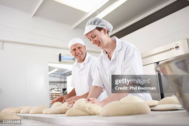 chefs baking in kitchen - baking bread imagens e fotografias de stock