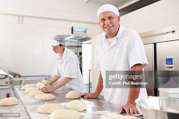 chefs baking in kitchen - baker man stock pictures, royalty-free photos & images