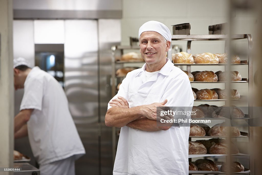 Smiling chef standing in kitchen