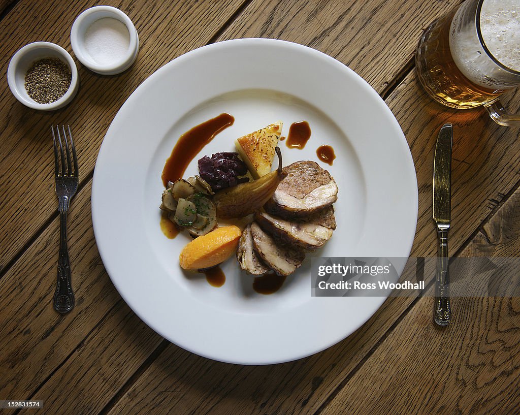 Plate of stuffed pork with pear