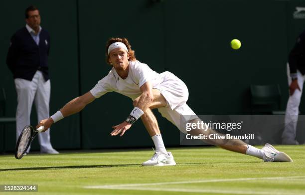 Andrey Rublev stretches to play a forehand against Alexander Bublik of Kazakhstan in the Men's Singles fourth round match during day seven of The...