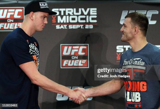 Opponents Stefan Struve and Stipe Miocic shake hands during a UFC press conference at the Hilton Hotel on September 27, 2012 in Nottingham, England.