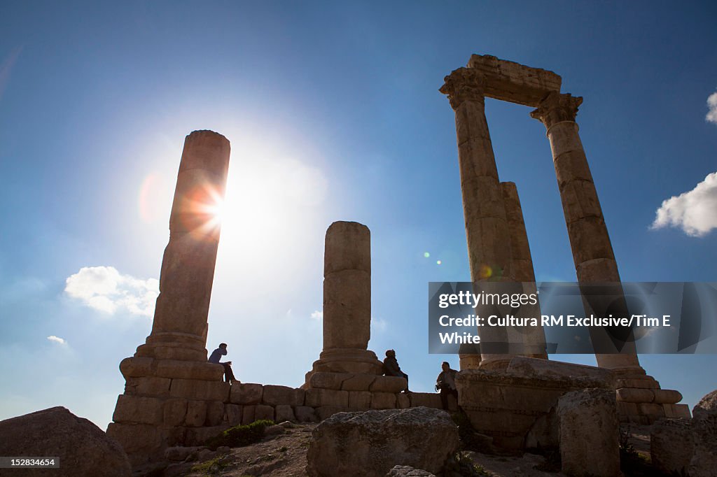 Silhouettes of column ruins