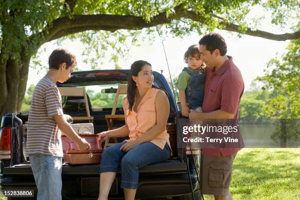 hispanic family fishing together - houston texas people stock pictures, royalty-free photos & images