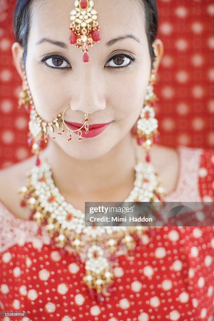 Young Woman in Red Sari with Wedding Jewelry