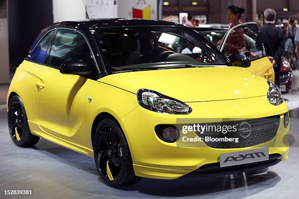 An Opel Adam automobile, produced by General Motors Co. , sits on display on the first day of the Paris Motor Show in Paris, France, on Thursday,...