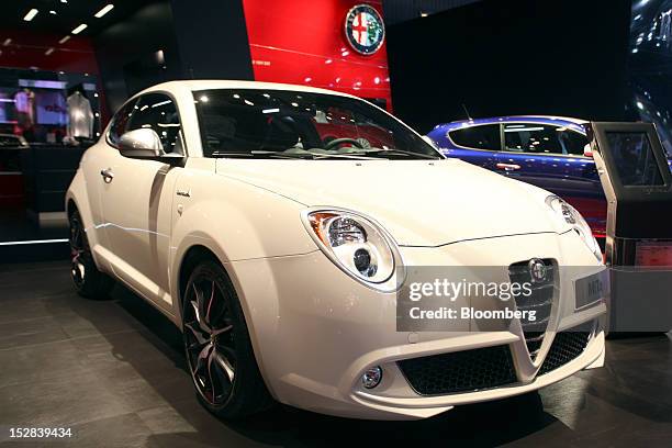 An Alfa Romeo MiTo automobile, produced by Fiat SpA, sits on display on the on the first day of the Paris Motor Show in Paris, France, on Thursday,...