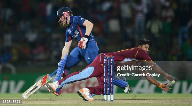 Eoin Morgan of England makes his ground underpressure from Ravi Rampaul of the West Indies during the ICC World Twenty20 2012 Super Eights Group 1...