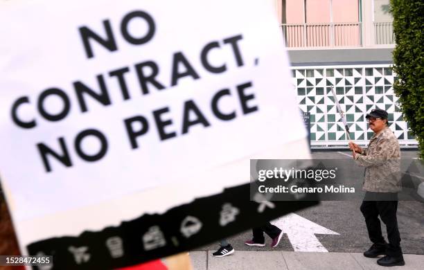 Jacinto Antonio Herrera walks the picket line with fellow Unite Here Local 11 hotel workers in front of the Viceroy Hotel in Santa Monica on July 12,...