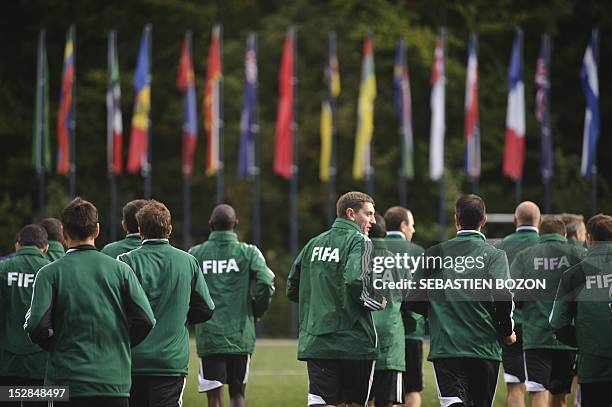 Football referees run during a meeting for potential referees for the 2014 World Cup Brazil, on September 27, 2012 in Zurich. Fifty-two people...