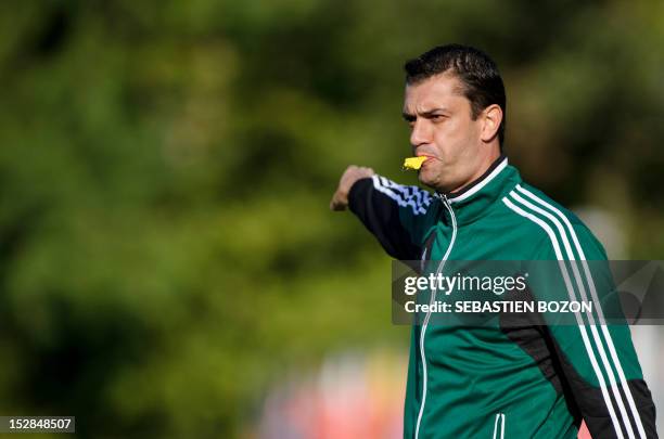 Hungarian referee, Viktor Kassai, takes part in an initial workshop during a meeting for potential referees for the 2014 World Cup Brazil, on...