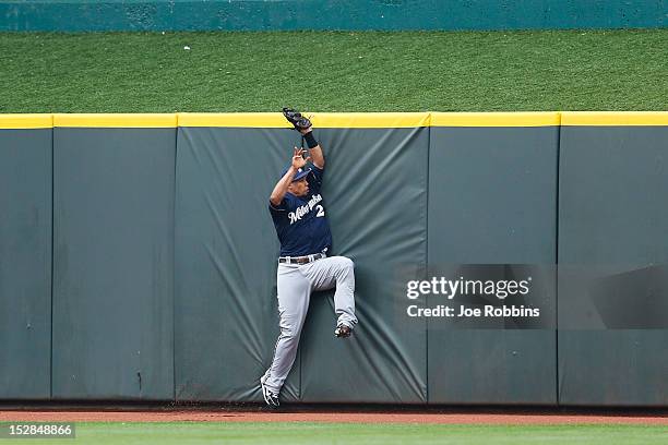 Carlos Gomez of the Milwaukee Brewers catches a fly ball against the center field wall after a hit by Jay Bruce of the Cincinnati Reds during the...