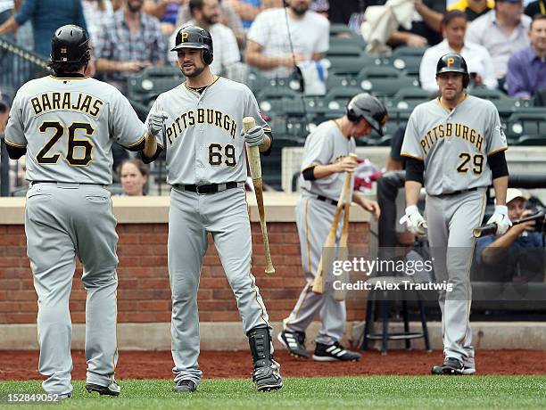 Rod Barajas of the Pittsburgh Pirates is congratulated by Jordy Mercer after hitting a home run against the New York Mets at Citi Field on September...