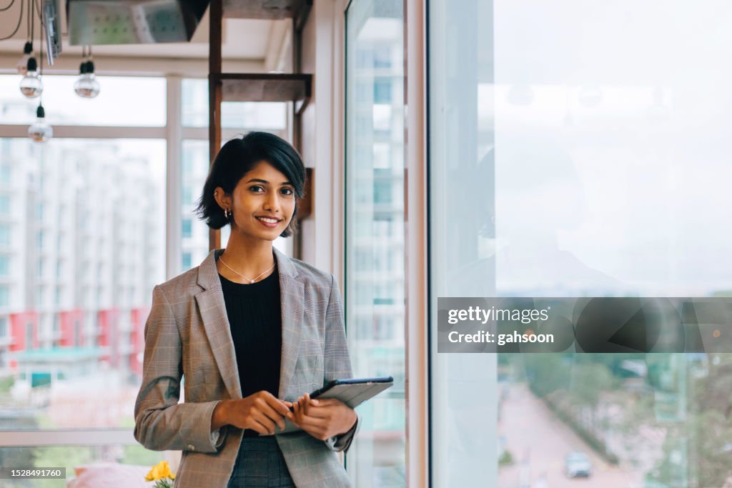Young Businesswoman Posing by Window