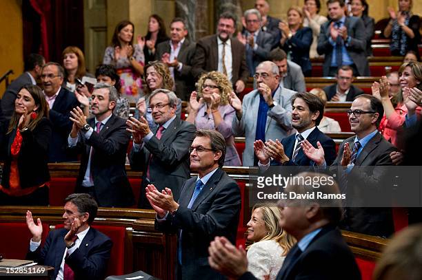 The Catalan President Artur Mas applauds after members of the Catalan Parliament voted in favour of the right of the Catalan people to hold a...