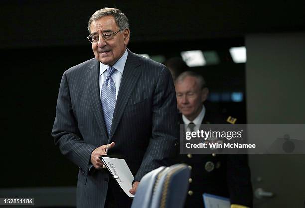 Secretary of Defense Leon Panetta and Chairman of the Joint Chiefs of Staff Gen. Martin Dempsey arrive for a press conference at the Pentagon...