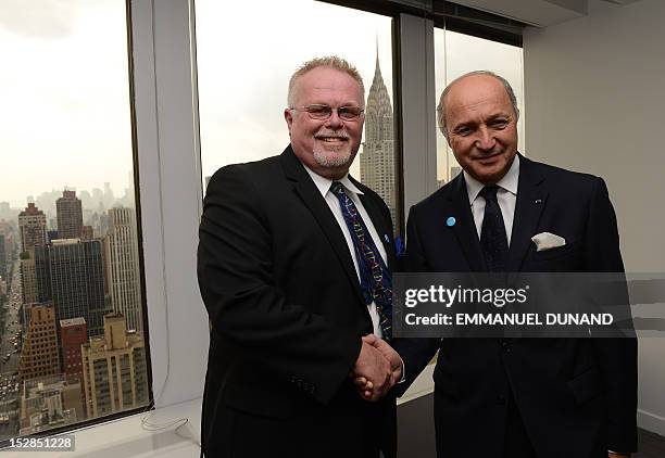 French Foreign Minister Laurent Fabius meets with Kirk Bloodsworth, the first US citizen sentenced to death row who was exonerated by DNA...