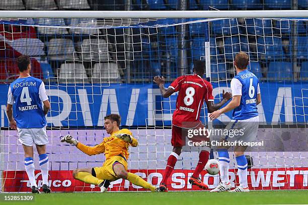 Mohamadou Idrissou of Kaiserslautern scores the second goal against Marcel Maltritz , Andreas Luthe and Lukas Sinkiewicz of Bochum during the Second...