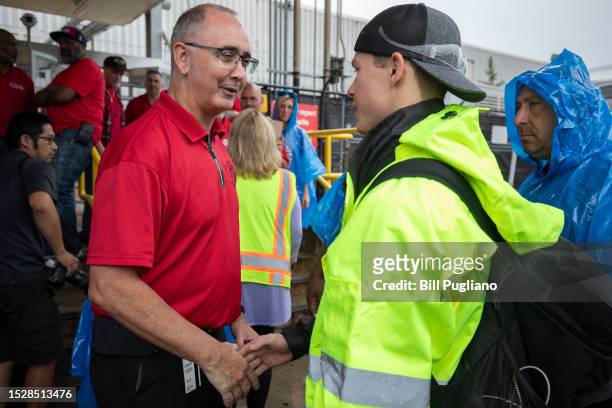 United Auto Workers President Shawn Fain speaks with workers at the Ford Michigan Assembly Plant on July 12, 2023 in Wayne, Michigan. The UAW today...